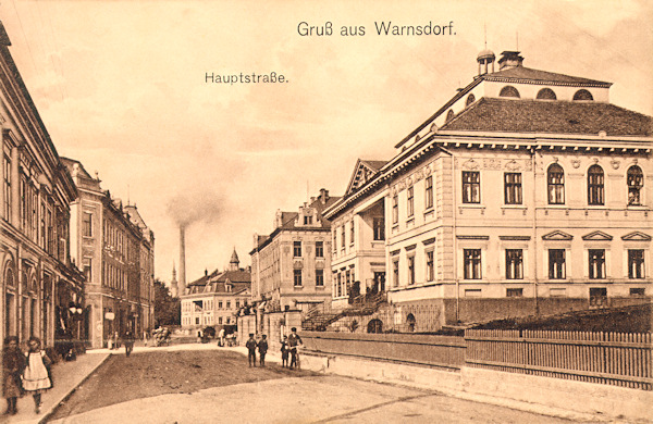 This picture postcard from the beginning of the 20th century shows the monumental houses along of the main street (Národní ulice-street). In the foreground there is the house No. 512 built in 1798. In the 90s of the 20th century this  house had been renovated and since then it is protected as a historic monument and serves the primary art school. On the right side of the end of the street we see the house No. 506 the original seat of the textile company Hanisch in which since 1930 was the municipal public library. After World War Two the house went to wreck and in 1977 it was demolished.