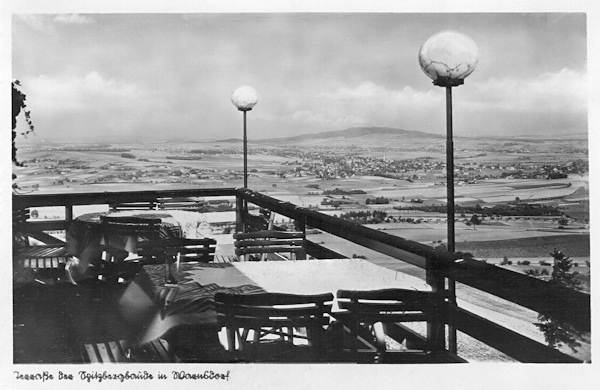 This picture postcard from the 30s of the 20th century presents the view from the terrace of the restaurant on the Špičák hill to the north over Leutersdorf and the Kottmar hill (in Germany).