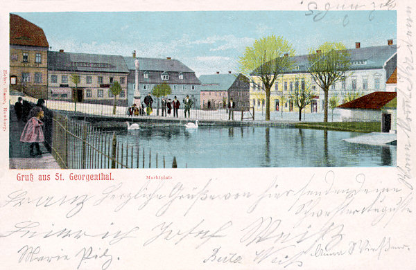 On this picture postcard from the turn of the 19th and 20th century there is the northeastern part of the market place of Jiřetín with the small pond built as early as the town was founded to serve in the case of a fire. In the sixties of the 20th century the houses on the western side of the square had to make place for the new unattractive building of a shopping centre.