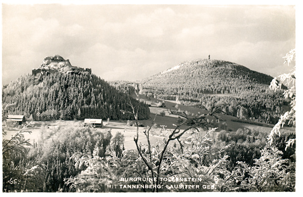 This winter-time picture postcard shows the ruins of Tolštejn castle as seen form the Čertova pláň ridge. In the background there is the Jedlová-hill.