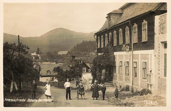 This picture postcard shows the main road at the present time municipality. To-day the building is perfectly rebuilt.