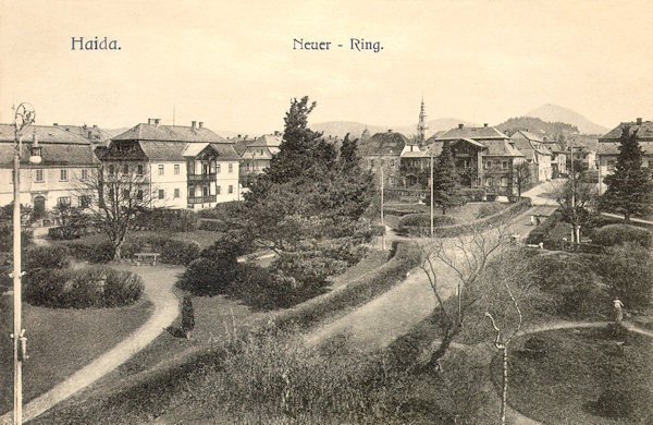 This picture postcard from the turn of the century shows the parklike Palackého-náměstí-square as seen from its south end.