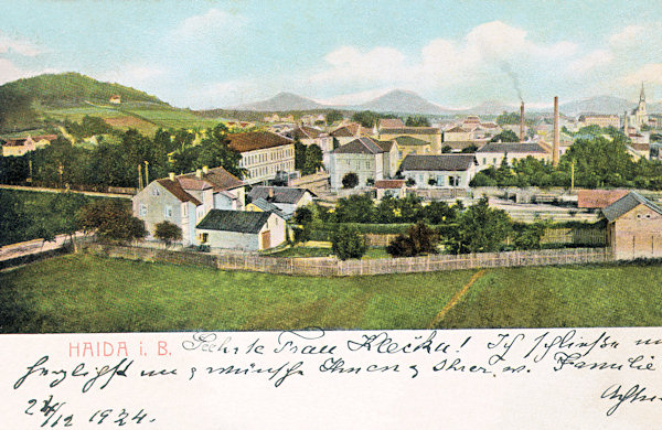 This picture postcard from about 1920 shows the houses near of the level crossing az the northern end of the railway station. To the right in the background there is the church Asumption of the Virgin, to the left the Borský vrch-hill.