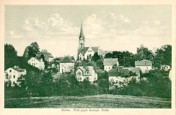 This picture postcard shows the evangelic church built in 1902 with the surrounding houses built in the twenties of the 20th century.