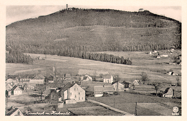This picture postcard from the years before World War One shows the upper part of the village Valy with the former inn „Am Kammweg“ (=Ridgeway) in the foreground. The horizon is filled with the hill Hvozd with its two peaks with the lookout tower and the German chalet.