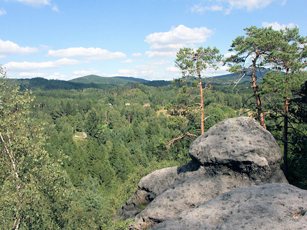 View from the Křížová věž-rock over the village Naděje to the Plešivec hill.